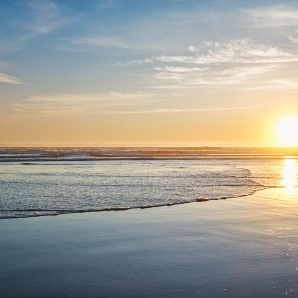 Atlantic ocean sunset with surging waves at Fonte da Telha beach, Costa da Caparica, Portugal